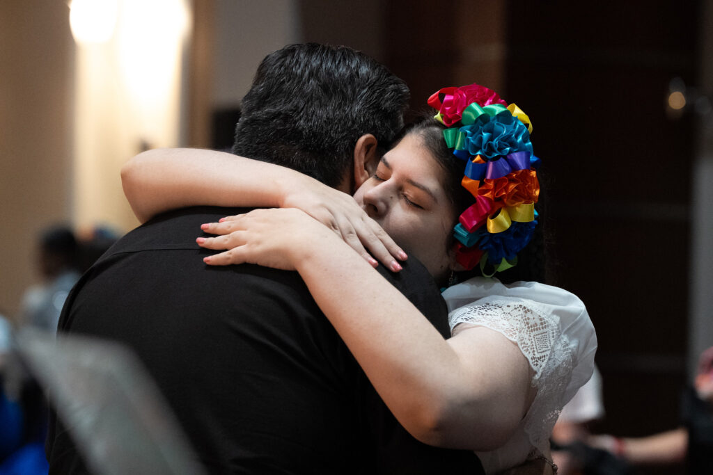 A quiet moment of connection during the C.A.M.P. University gala.